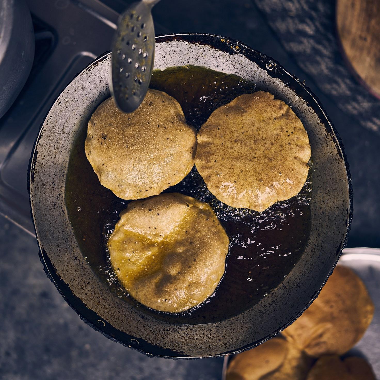 Diverse group sharing a meal, showcasing the social bonds formed through collaborative cooking